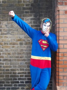 One of the numerous 'fancy dressed' Supermans outside a nearby hotel. The costumes that pass by our offices bring humour to FFT staff, in contrast to their work.